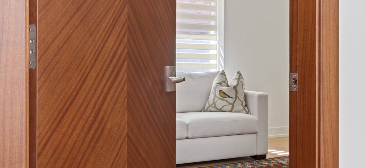 left-view-of-modern-interior-door-with-hardware-looking-onto-a-room